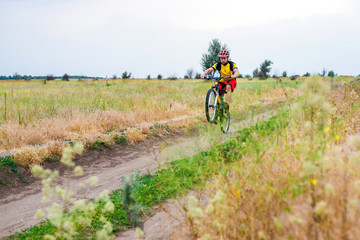 Fototapeta premium Concept of an active lifestyle, a cyclist riding a bicycle, free space.