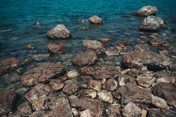 Sea background with beautiful stones in Thailand.