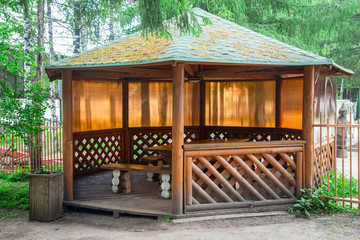 Wooden pergola among parkland
