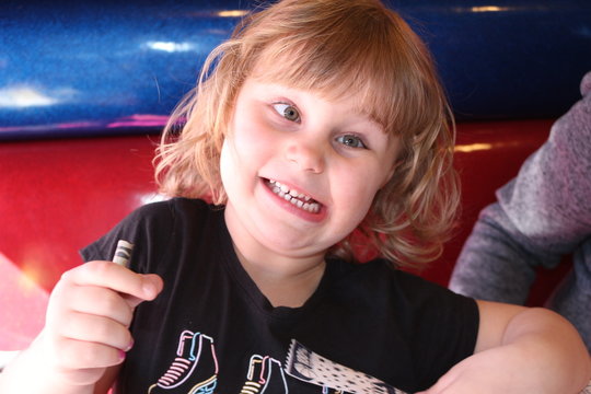 Preschool Girl Making Silly Faces And Being A Funny Person 