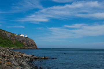 low angle view on lighthouse on edge of cliff in whitehead northern Ireland 