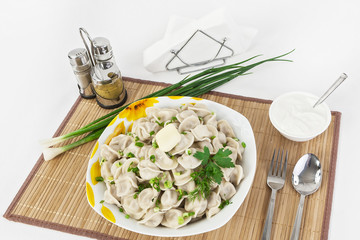 Russian dumplings with herbs and onions.