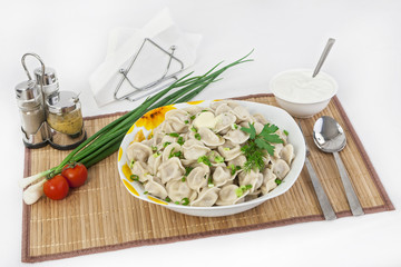 Russian dumplings with herbs and onions.
