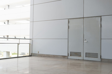 sidewalk by street wall & door