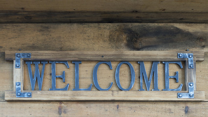 metal welcome cut sign