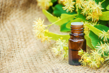 linden extract and flowers in a small bottle. 