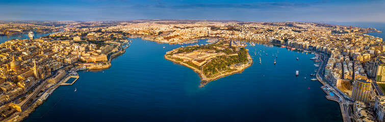 Valletta, Malta - Aerial panoramic skyline view of Valletta, Sliema, Manoel Island, Gzira, Ta' Xbiex, Msida and Floriana at sunrise