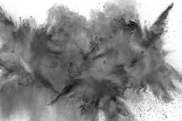 Black powder explosion. Closeup of black dust particles splash isolated on  background.