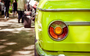 Green car retro with a round headlight, round headlight retro car, rear view, green color