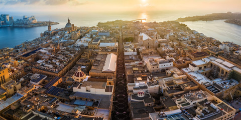 Valletta, Malta - Sunrise and the ancient city of Valletta from above with Triq Ir-Repubblika, the narrow high street of Valletta - obrazy, fototapety, plakaty