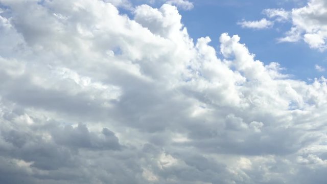 The blue cloudy sky movement on bright natural background.

