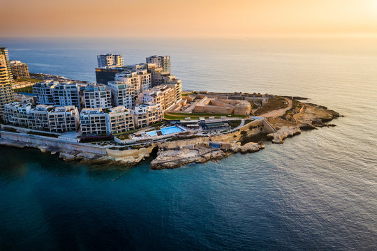 Sliema, Malta - Sunrise at Tigne point with residential buildings