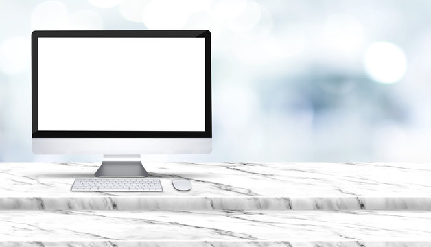 Blank screen of desktop computer on step white marble table with blur hospital at background,Mock up template for display of design,Banner for advertise of health care business product,panoramic.