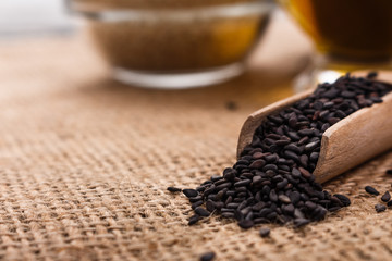 fresh sesame seeds on a rustic background