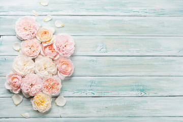 Garden rose flowers on wooden background