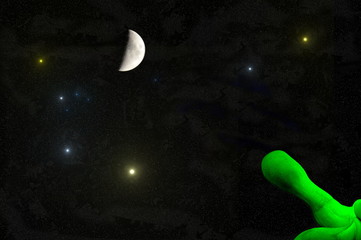 universe - green alien hand with outstretched finger pointing to the moon and the stars