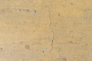 Old yellow wall texture in cracks