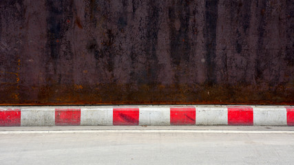 concrete road - sidewalk and curb red-white - obrazy, fototapety, plakaty