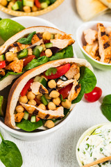 Pita Sandwiches with Grilled Chicken and Chickpea or Garbanzo Beans Salad. Selective focus.