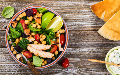 Mediterranean Grilled Chicken Salad with Chickpea or Garbanzo Beans. Selective focus.
