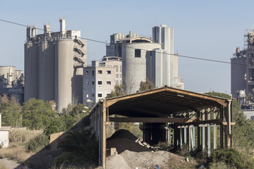 Industrial Sagunto, cement factory behind the ship in ruins
