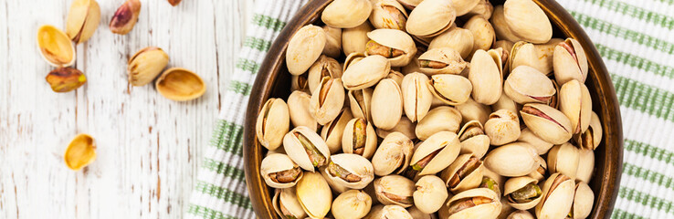 Fototapeta premium Sea Salt Roasted Pistachios Panoramic image. Selective focus.