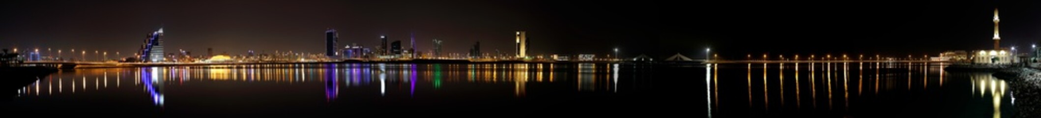 Fototapeta na wymiar Bahrain skyline at night, a broad panoramic view