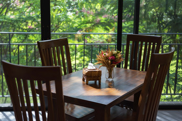 dinning table and flower  with greenery view