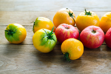 Yellow And Red Tomatoes On A Wooden Table