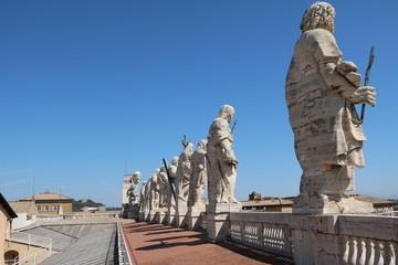 Sculptures on the roof of St. Peter's Basilica in the Vatican in Rome, Italy