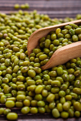 fresh Mung beans on a rustic wooden background