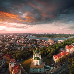 Papier Peint photo Kiev Panorama of the city of Kiev with the domes of St. Andrew's Church in the foreground, the historic district of Podol and the Dnieper River in the background. Cityscape