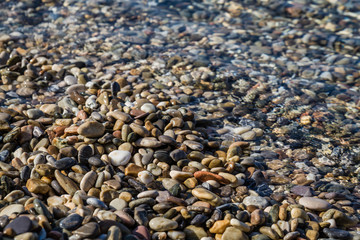 Sea Pebbles on a Clean Beach as Texture, Background
