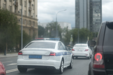 Patrol police car on the street in Moscow on a sunny day