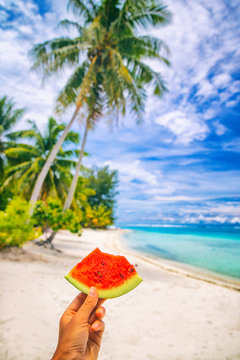 Summer healthy eating woman holding watermelon taking food selfie on tropical beach vacation, Hawaii.