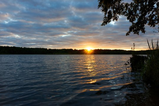 Fototapeta View on a lake during sunrise