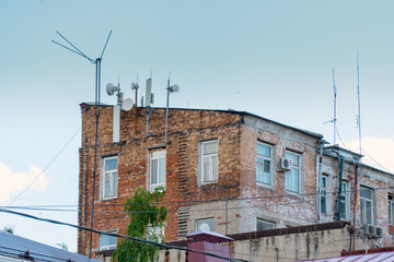 Many antennas on an old building
