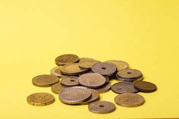 coins are scattered on yellow background