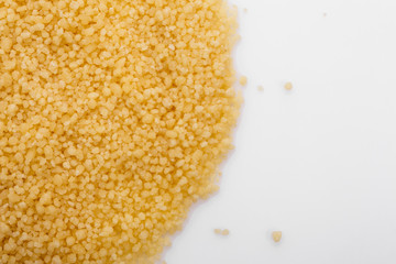 fresh couscous on a white acrylic background