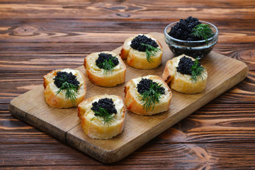 Toastes with black caviar. Spase for text or design.