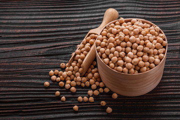 uncooked chickpeas on a wooden rustic background