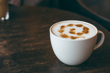 Cup of coffee with beautiful latte art. Place for text
