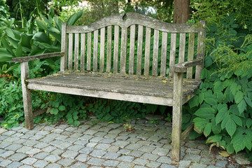 Park bench in a Bavarian park to relax and rest

