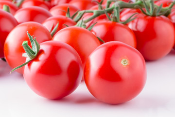 Beautiful ripe tomatoes on white background. Ingredient for many dishes, sauces, salads and drinks.