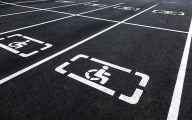 Parking places with wheelchair symbol and marking lines