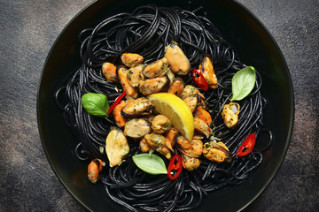 Black spaghetti pasta with mussels.Top view.