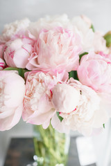 Floristry concept. Bouquet of beautiful flowers on gray table. Spring colors. the work of the florist at a flower shop.