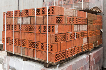 Folded and packed red bricks