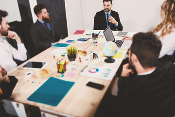 Team of businessmen work together in office. Concept of teamwork and partnership