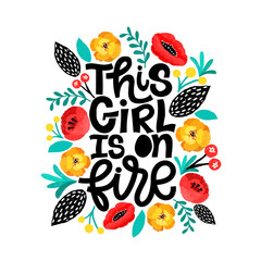 This girl is on fire. Handdrawn illustration. Positive quote made in vector.Motivational slogan. Inscription for t shirts, posters, cards. Floral digital sketch style design. Flowers around.